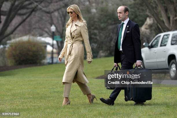 Ivanka Trump and White House Senior Advisor Stephen Miller walk across the South Lawn before departing the White House with U.S. President Donald...