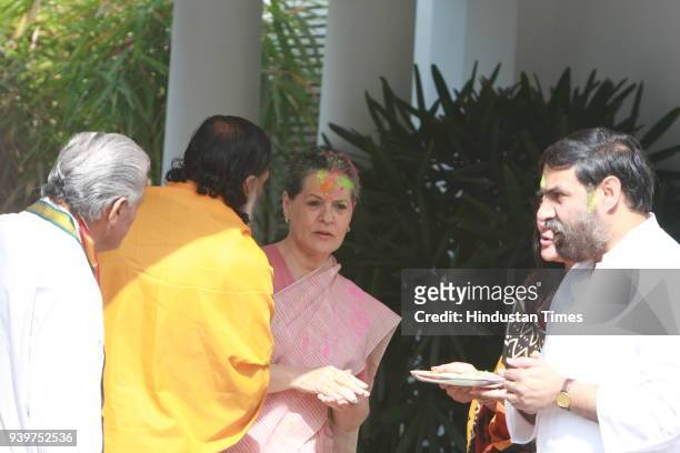 Chairperson of the Congress-led UPA government and Congress Party President Sonia Gandhi celebrates "Holi" with party leaders in New Delhi