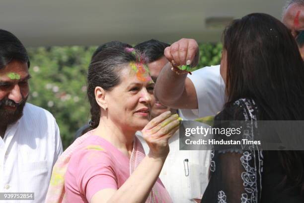 Chairperson of the Congress-led UPA government and Congress Party President Sonia Gandhi celebrates "Holi" with party leaders in New Delhi