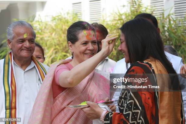 Chairperson of the Congress-led UPA government and Congress Party President Sonia Gandhi celebrates "Holi" with party leaders in New Delhi