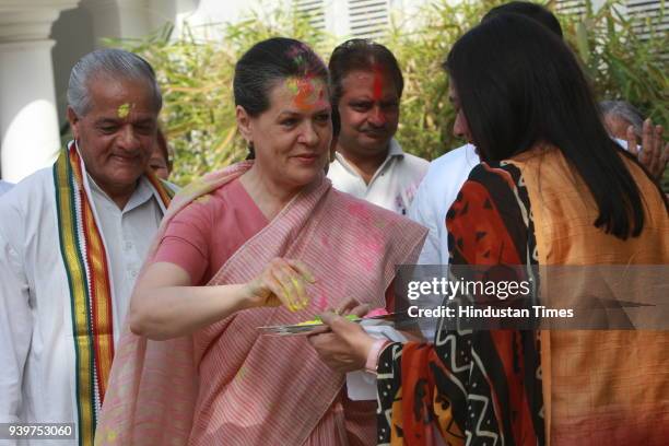 Chairperson of the Congress-led UPA government and Congress Party President Sonia Gandhi celebrates "Holi" with party leaders in New Delhi