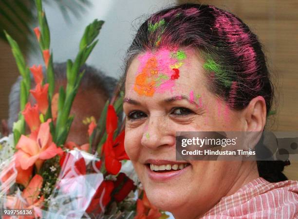 Chairperson of the Congress-led UPA government and Congress Party President Sonia Gandhi celebrates "Holi" with party leaders in New Delhi