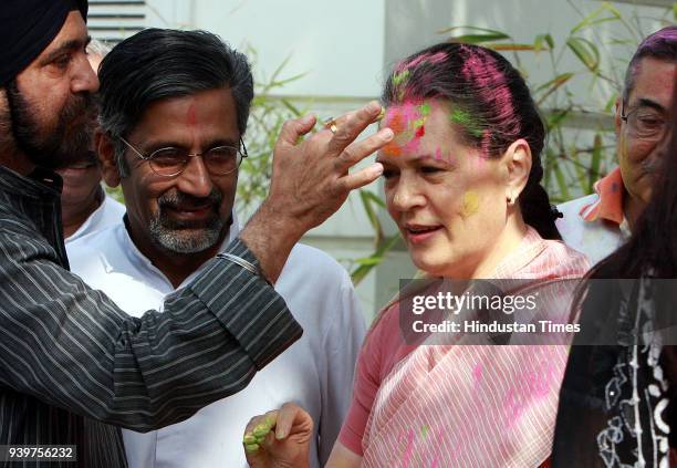 Chairperson of the Congress-led UPA government and Congress Party President Sonia Gandhi celebrates "Holi" with party leaders in New Delhi