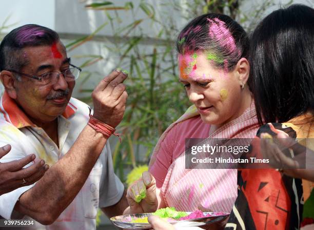 Chairperson of the Congress-led UPA government and Congress Party President Sonia Gandhi celebrates "Holi" with party leaders in New Delhi