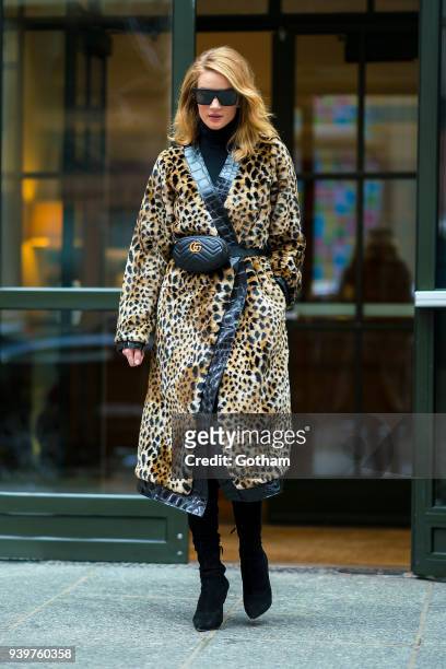 Rosie Huntington-Whiteley is seen wearing an Attica coat with a Gucci fanny pack in SoHo on March 29, 2018 in New York City.