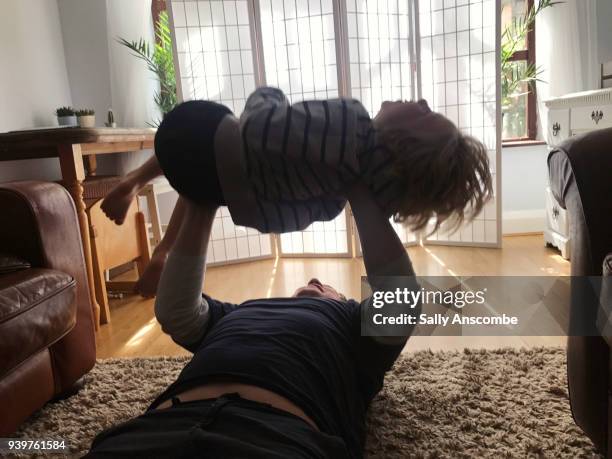 child playing with father - dad press ups kids stock pictures, royalty-free photos & images