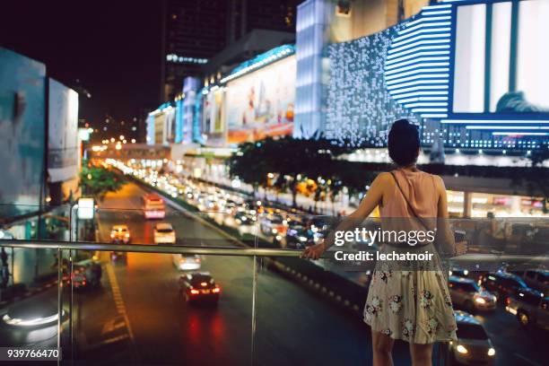 tourist woman enjoys the view at siam square in bangkok, thailand - square one mall stock pictures, royalty-free photos & images