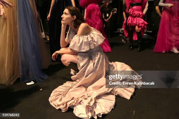 Model backstage ahead of the Mercedes-Benz presents Sudi Etuz show during Mercedes Benz Fashion Week Istanbul at Zorlu Performance Hall on March 29,...