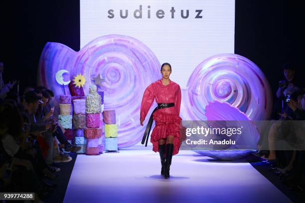 Model presents a creation of designer Sudi Etuz during the Mercedes-Benz Fashion Week/Fall Season 2018 at the Zorlu Performing Arts Center in...