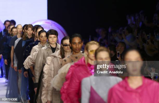 Models present a creation of designer Sudi Etuz during the Mercedes-Benz Fashion Week/Fall Season 2018 at the Zorlu Performing Arts Center in...