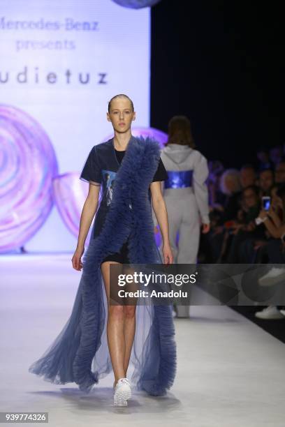 Model presents a creation of designer Sudi Etuz during the Mercedes-Benz Fashion Week/Fall Season 2018 at the Zorlu Performing Arts Center in...