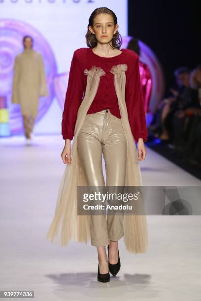 Model presents a creation of designer Sudi Etuz during the Mercedes-Benz Fashion Week/Fall Season 2018 at the Zorlu Performing Arts Center in...