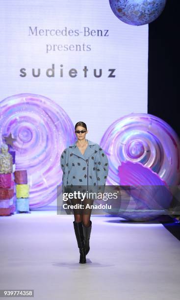 Model presents a creation of designer Sudi Etuz during the Mercedes-Benz Fashion Week/Fall Season 2018 at the Zorlu Performing Arts Center in...