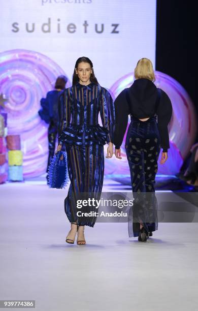 Model presents a creation of designer Sudi Etuz during the Mercedes-Benz Fashion Week/Fall Season 2018 at the Zorlu Performing Arts Center in...