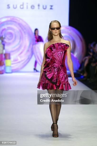 Model presents a creation of designer Sudi Etuz during the Mercedes-Benz Fashion Week/Fall Season 2018 at the Zorlu Performing Arts Center in...