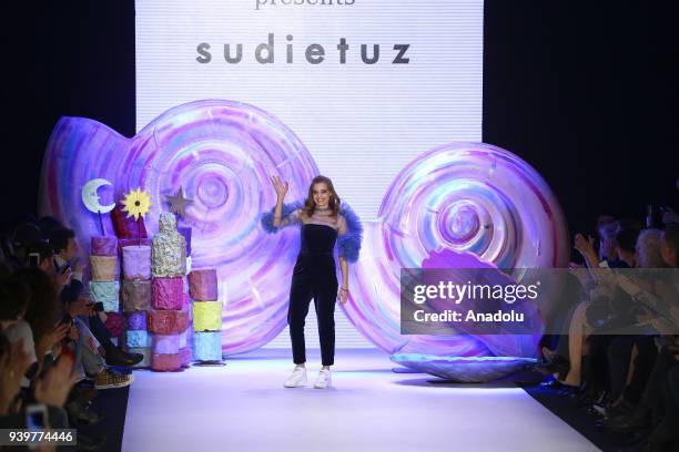 Designer Sudi Etuz greets the crowd after the presentation of her creation during the Mercedes-Benz Fashion Week/Fall Season 2018 at the Zorlu...