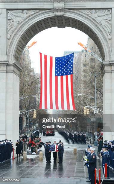 The flag draped coffin of FDNY Fire Marshal Capt. Christopher "Tripp" Zanetis is carried during his funeral in Washington Square Park March 29, 2018...