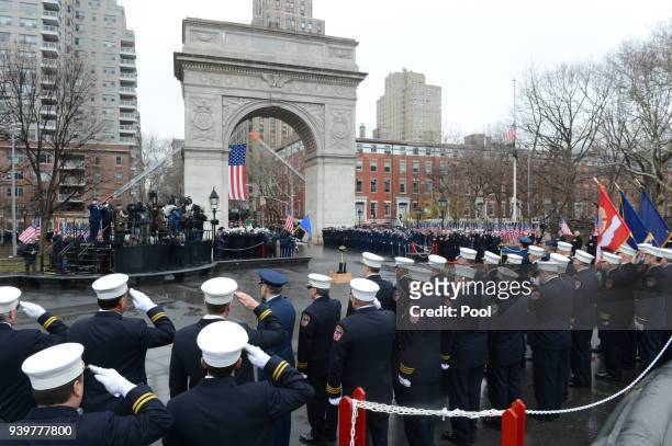 Firefighters salute during the funeral of FDNY Fire Marshal Capt. Christopher "Tripp" Zanetis in Washington Square Park March 29, 2018 in New York...
