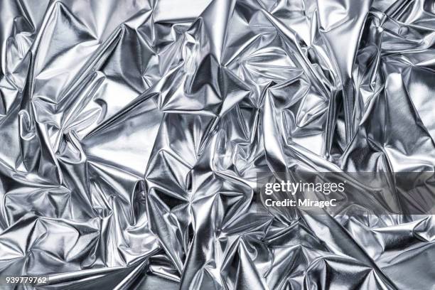 bright silver textile texture - shiny fabric stock pictures, royalty-free photos & images