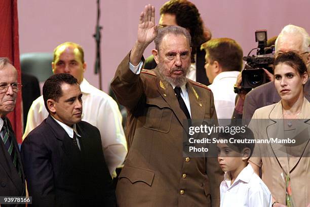 Cuba�s President Fidel Castro stands next to Elian Gonzalez and Juan Miguel Gonzalez, father of Elian as he waves goodbye after addressing the nation...