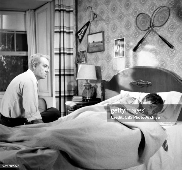 Television sitcom, The Many Loves of Dobie Gillis, episode: Greater Love Hath No Man. Left to right, Frank Faylen and Bob Denver , hiding under bed...