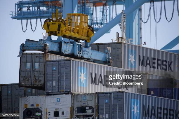 Gantry cranes unload Maersk A/S containers from a ship at the Port of Los Angeles in Los Angeles, California, U.S., on Wednesday, March 28, 2018....