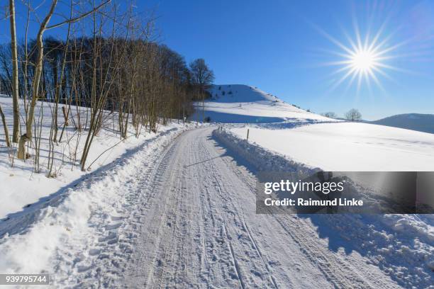 road in landscape in winter, gersfeld, rhoen mountain, hesse, germany - rhön stock-fotos und bilder