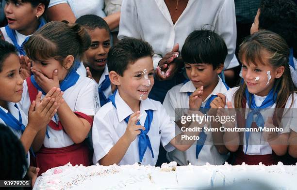 Elian Gonzalez , shares a cake with classmates during the celebration of his seventh birthday in his school, on December 6 in Cardenas, Cuba. Elian...