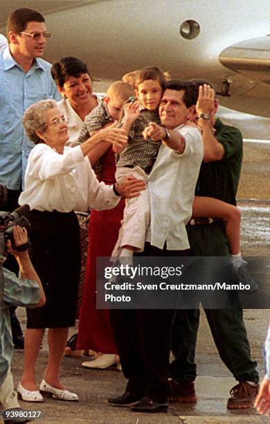 Elian Gonzalez is being embraced by his grandfather Juan Gonzalez, upon his arrival at the Jose Marti airport, on June 28 in Havana, Cuba. Elian...
