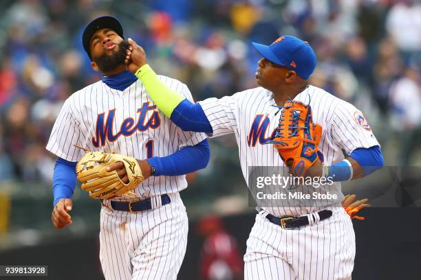 Amed Rosario and Yoenis Cespedes of the New York Mets joke around in eighth inning against the St. Louis Cardinals on Opening Day at Citi Field on...