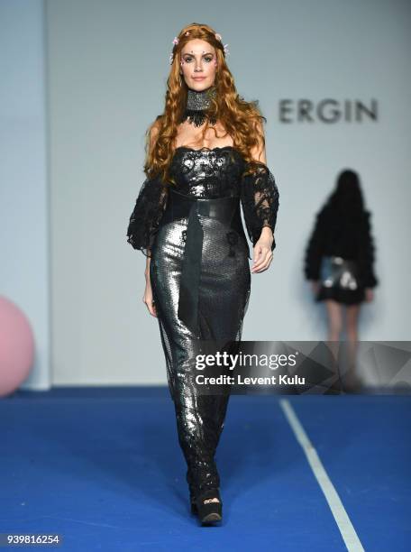 Model walks the runway for the Tuba Ergin show during Mercedes Benz Fashion Week Istanbul at Zorlu Performance Hall on March 29, 2018 in Istanbul,...