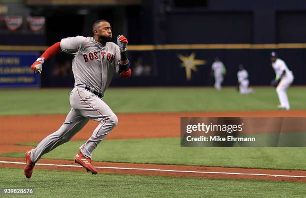 Eduardo Nunez of the Boston Red Sox hits an inside the park home run in the second inning during a game against the Tampa Bay Rays on Opening Day at...