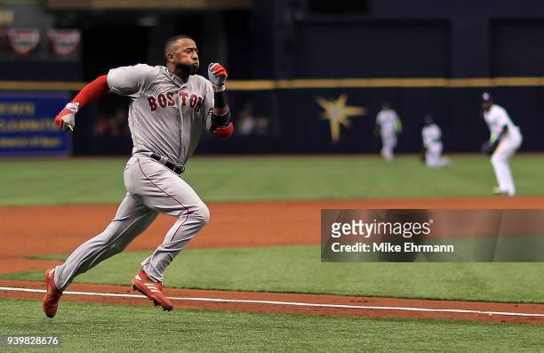 Eduardo Nunez of the Boston Red Sox hits an inside the park home run in the second inning during a game against the Tampa Bay Rays on Opening Day at...