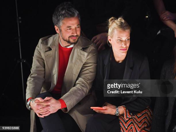 Lhan Mansiz and guest attend the Mercedes-Benz presents Sudi Etuz show during Mercedes Benz Fashion Week Istanbul at Zorlu Performance Hall on March...