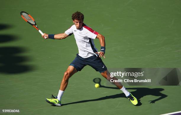 Pablo Carreno Busta of Spain runs to play a forehand against Kevin Anderson of South Africa in their quarterfinal during the Miami Open Presented by...