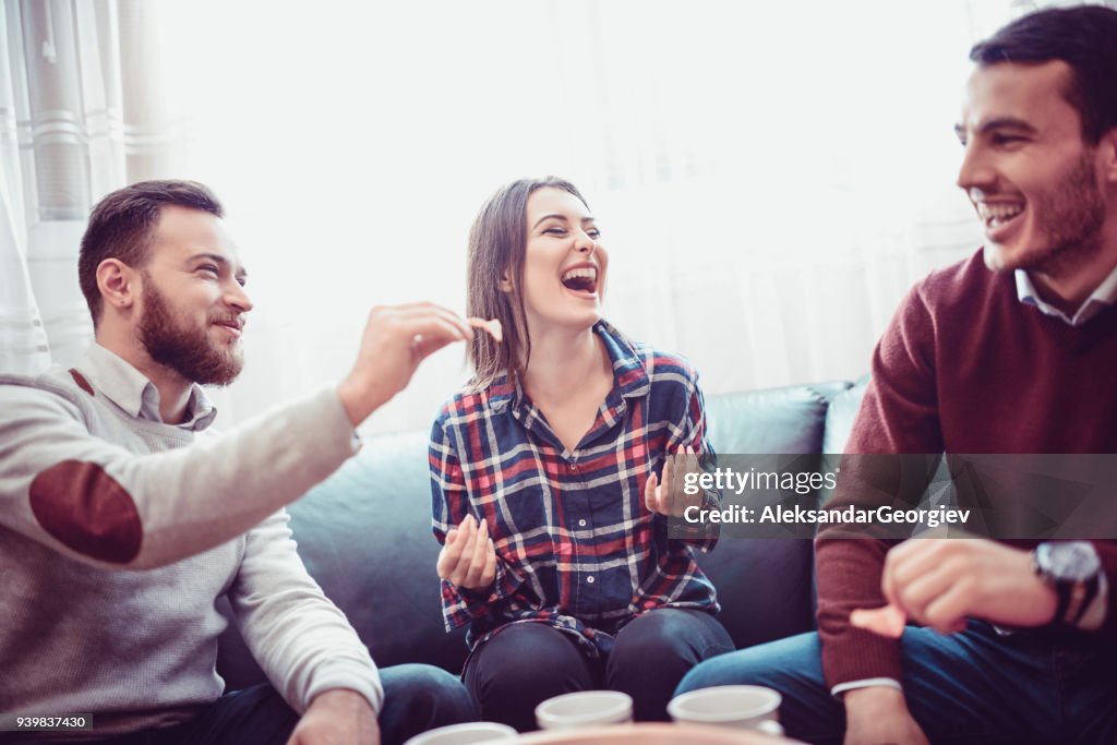 Group of Friend Eating Snacks, Conversing and Having Fun Time Together