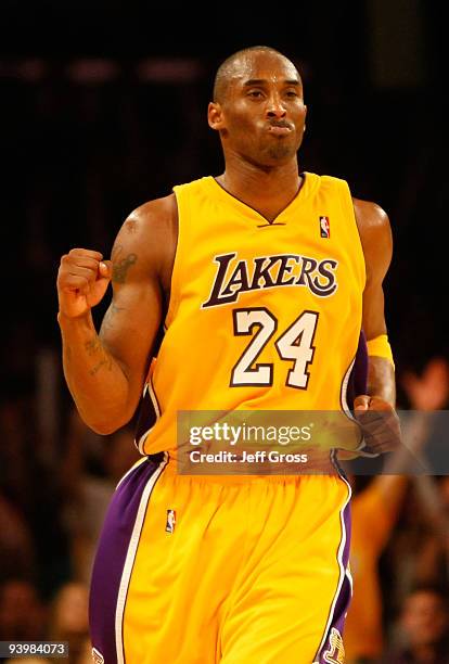 Kobe Bryant of the Los Angeles Lakers celebrates after making a basket against the Miami Heat in the fourth quarter at Staples Center on December 4,...