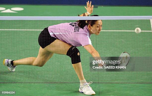 Netherland's Yao Jie returns to Wong Mew Choo of Malaysia in the first women's semi-final match at the Badminton World Super Series Masters Finals in...