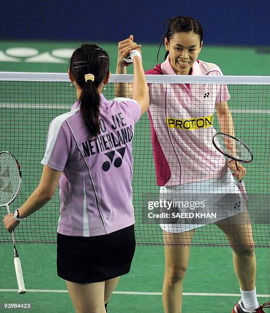Wong Mew Choo of Malaysia shakes hands with Yao Jie of the Netherlands after defeating her in the first women's semi-final match at the Badminton...