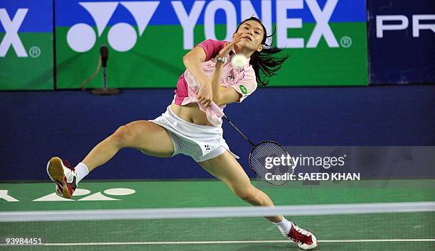Wong Mew Choo of Malaysia returns to Yao Jie of the Netherlands in the first women's semi-final match at the Badminton World Super Series Masters...
