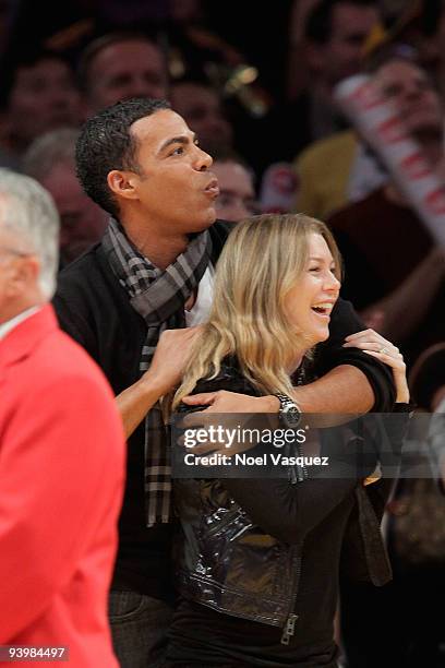 Ellen Pompeo and Chris Ivery attend a game between the Miami Heat and the Los Angeles Lakers at Staples Center on December 4, 2009 in Los Angeles,...