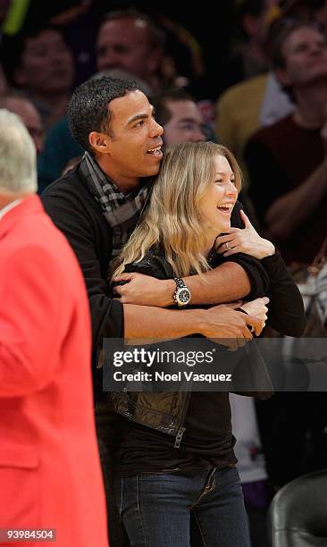 Ellen Pompeo and Chris Ivery attend a game between the Miami Heat and the Los Angeles Lakers at Staples Center on December 4, 2009 in Los Angeles,...