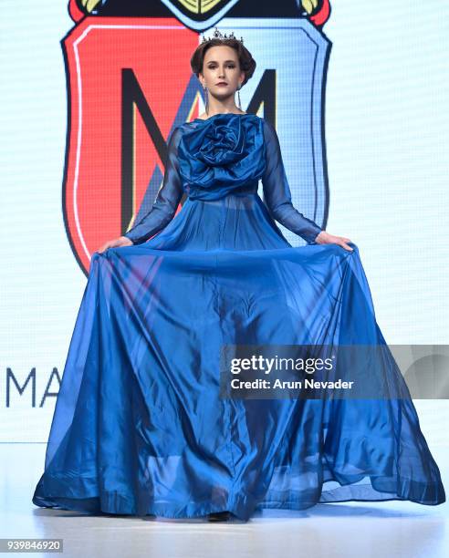 Model walks the runway wearing Madame Adassa at 2018 Vancouver Fashion Week - Day 7 on March 25, 2018 in Vancouver, Canada.