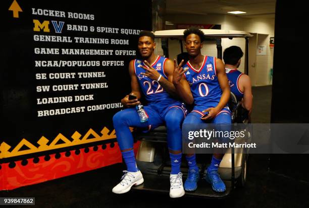 Silvio De Sousa and Marcus Garrett of the Kansas Jayhawks get carted through the halls during Media Day for the NCAA Photos via Getty Images Men's...