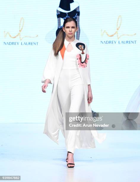 Model walks the runway wearing Nadrey Laurent at 2018 Vancouver Fashion Week - Day 7 on March 25, 2018 in Vancouver, Canada.