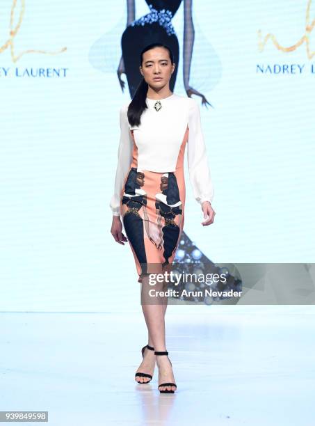 Model walks the runway wearing Nadrey Laurent at 2018 Vancouver Fashion Week - Day 7 on March 25, 2018 in Vancouver, Canada.
