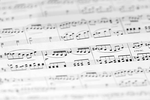 music sheet with soft focus, black and white image - chorus music stock pictures, royalty-free photos & images