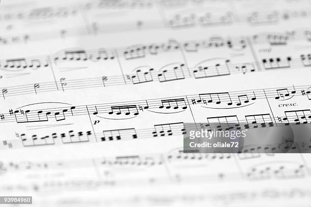 music sheet with soft focus, black and white image - answering stock pictures, royalty-free photos & images