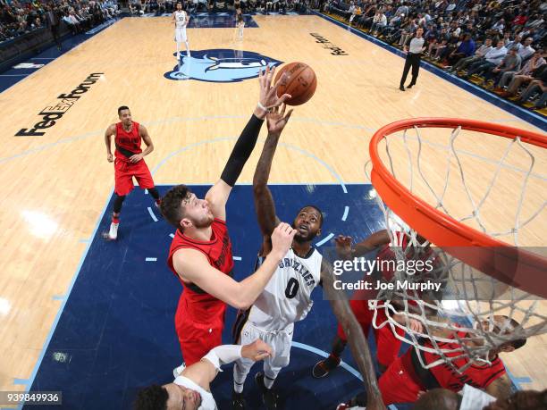 Jusuf Nurkic of the Portland Trail Blazers contests the shot by JaMychal Green of the Memphis Grizzlies during the game on March 28, 2018 at...