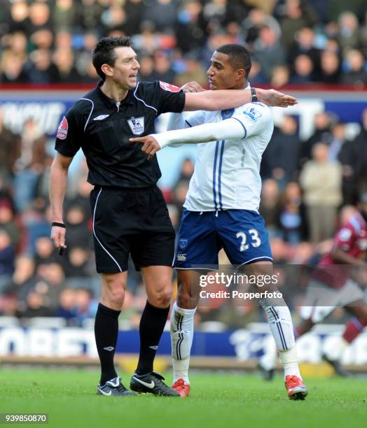 Kevin-Prince Boateng of Portsmouth argues with referee Lee Probert during the Barclays Premier League match between West Ham United and Portsmouth at...